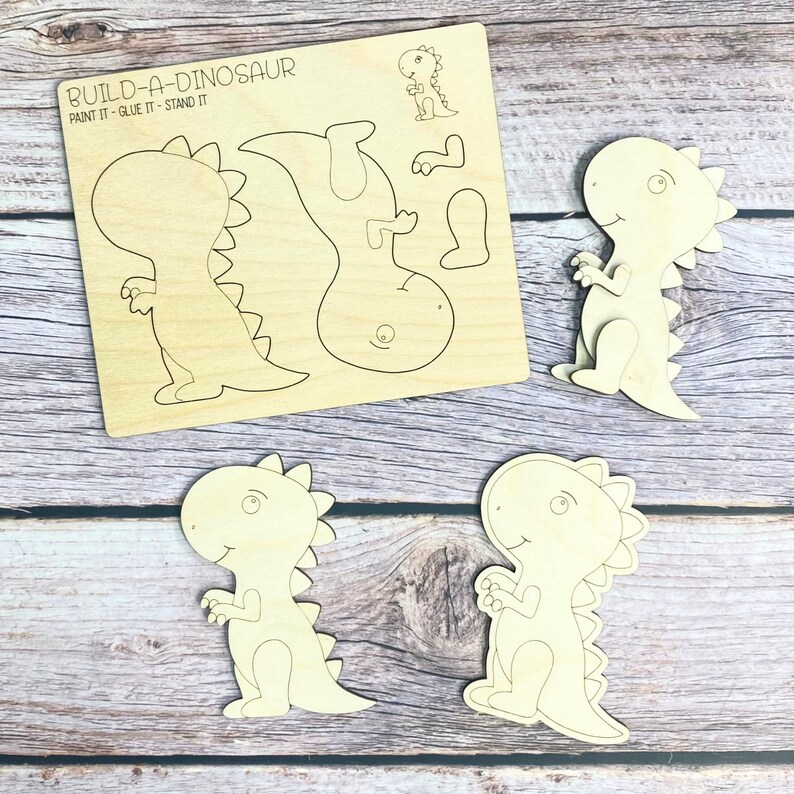 May include: Build-A-Dinosaur craft kit with five wooden pieces to paint, glue, and assemble. The kit includes a dinosaur body, head, tail, and two legs.