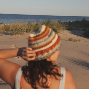 May include: A set of three ceramic mugs with a speckled, matte finish. The mugs are in shades of cream, light gray, and dark gray. Each mug has a simple, minimalist design, perfect for coffee or tea.