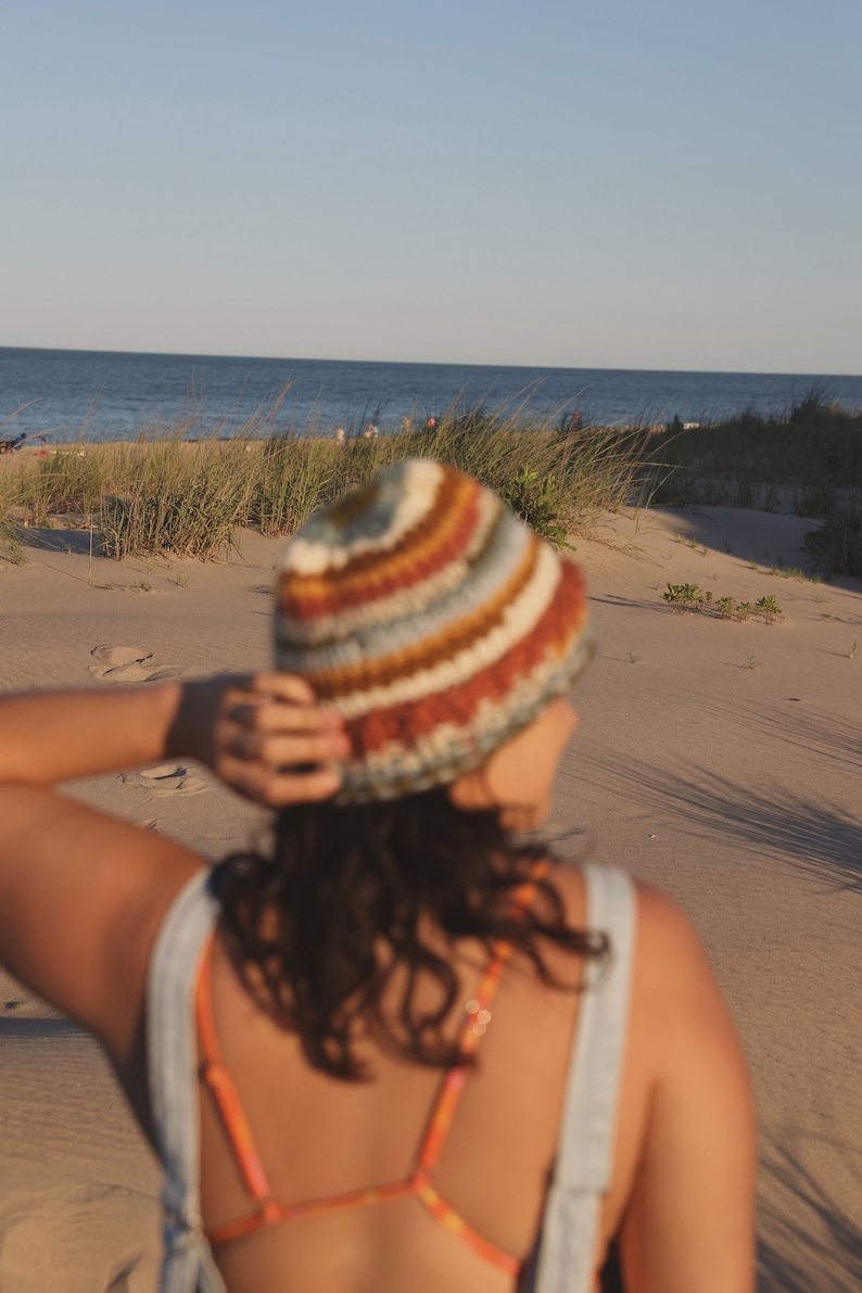 May include: A set of three ceramic mugs with a speckled, matte finish. The mugs are in shades of cream, light gray, and dark gray. Each mug has a simple, minimalist design, perfect for coffee or tea.