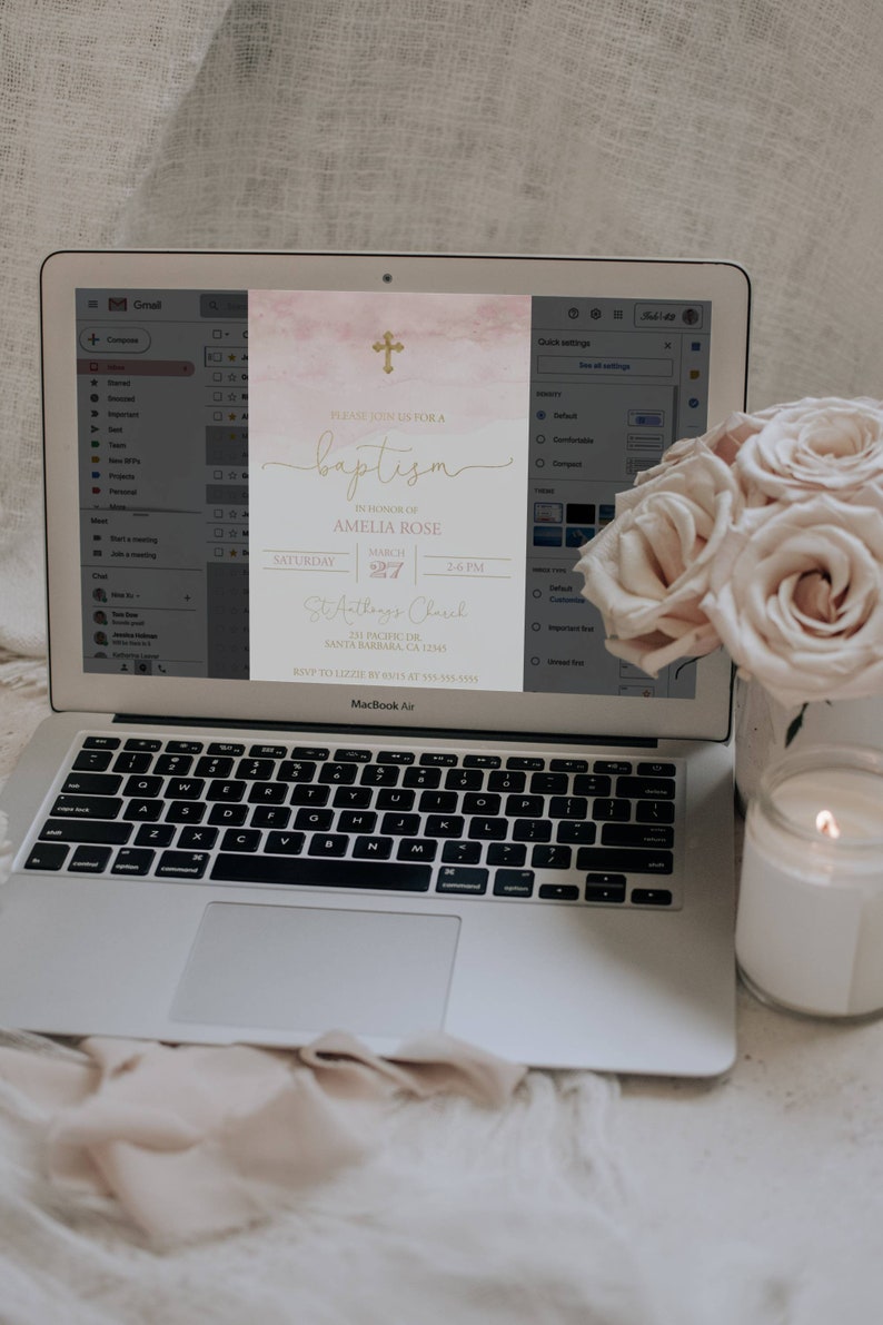 May include: A digital invitation for a baptism with a watercolor background in shades of pink and gold. The invitation features a gold cross, the text "Please join us for a baptism", the name "Amelia Rose", the date "March 27", the time "2-6 PM", the location "St. Anthony's Church", and the address "231 Pacific Dr, Santa Barbara, CA 1245".