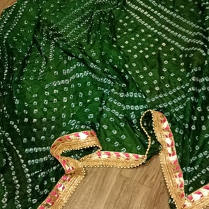 Beautiful green chuni bandhani dupatta with four side lace border