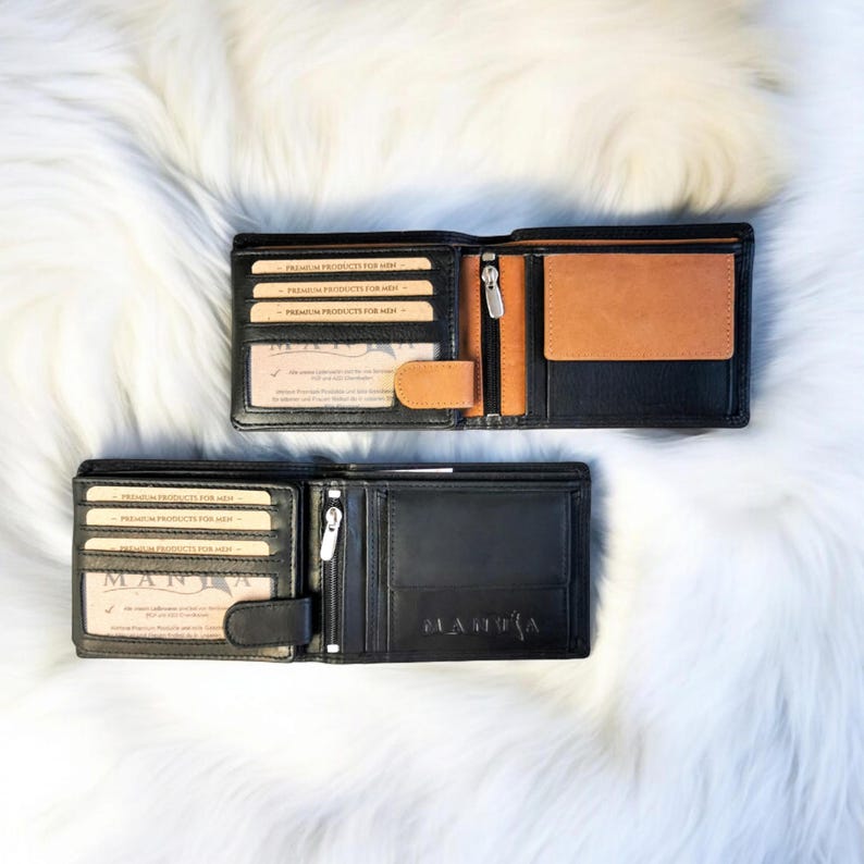 May include: Two black leather wallets with a brown leather interior. The wallets have multiple card slots and a money clip. The wallets are open to show the interior. The text "PREMIUM PRODUCTS FOR MEN" is printed on the inside of the wallets.
