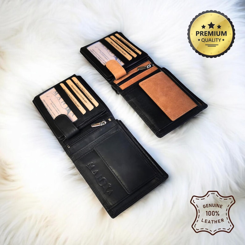 May include: Two black leather wallets with the word "MADIA" embossed on the front. One wallet has a brown leather interior and the other has a black leather interior. Both wallets have multiple card slots and a zippered compartment. The wallets are on a white fuzzy surface. The text "PREMIUM QUALITY" and "GENUINE 100% LEATHER" are visible in the image.