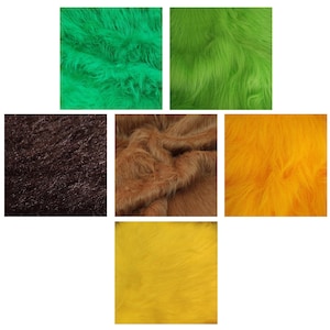 Könnte beinhalten: Sortiment von Kunstfell-Stoffmustern in verschiedenen Farben, darunter Grün, Braun, Gelb und Orange. Der Stoff hat eine weiche, flauschige Textur.