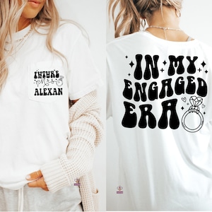 May include: Two white t-shirts with black text and graphics. The front shirt has a pocket with the text "Future Mrs. Alexan" and a small ring graphic. The back shirt has the text "In My Engaged Era" with a large ring graphic.