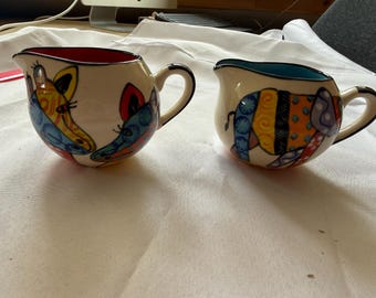 South African pottery- Funky Animal milk jugs
