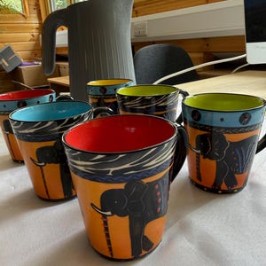 Funky animal Elephant sunset design South African hand made mugs
