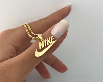 nike gold charm