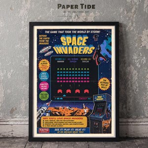 May include: A framed poster featuring a vintage Space Invaders arcade game graphic. The design includes the game title, a screen display with pixelated aliens, a cabinet illustration, and promotional text like The Game That Took The World By Storm.