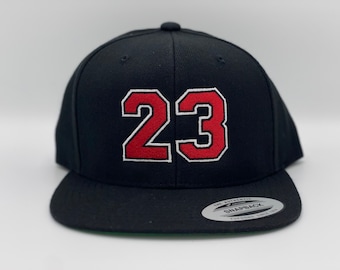 Chicago Bulls Michael Jordan 23 GOAT Yupoong SnapBack sombrero.