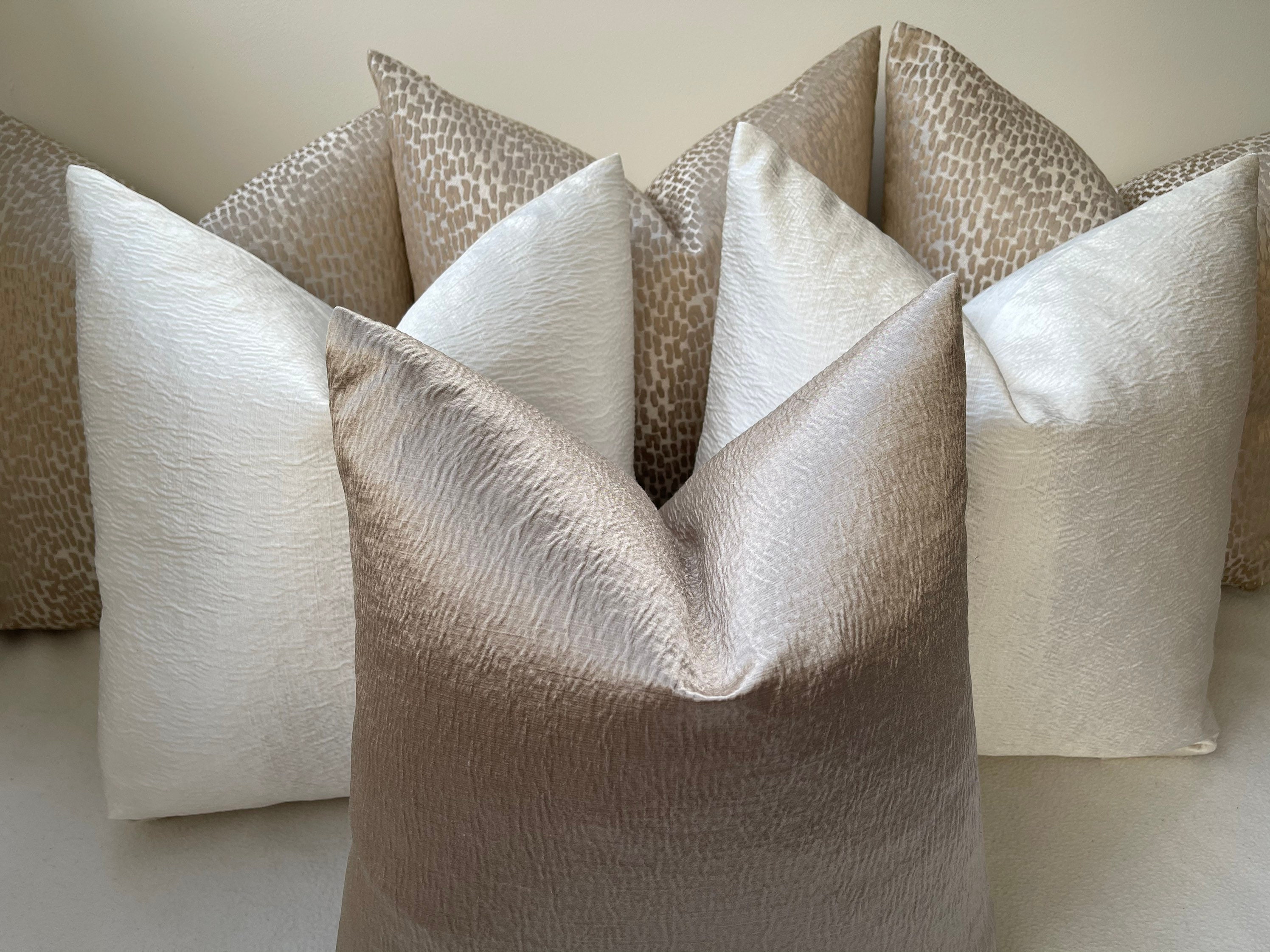 A Luxury Set of 6 Champagne Cream Cushions Soft Textured Cream