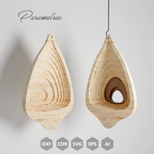 May include: Two wooden, teardrop-shaped hanging planters with layered interior design. The planters are light brown with a natural wood grain. The word "Parametree" is written in cursive. Icons for DXF, CDR, SVG, EPS, and AI are at the bottom.
