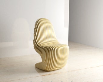 May include: A light wood chair with a unique design that resembles a hand. The chair is made of thin strips of wood that are layered and curved to create a comfortable and stylish seat.