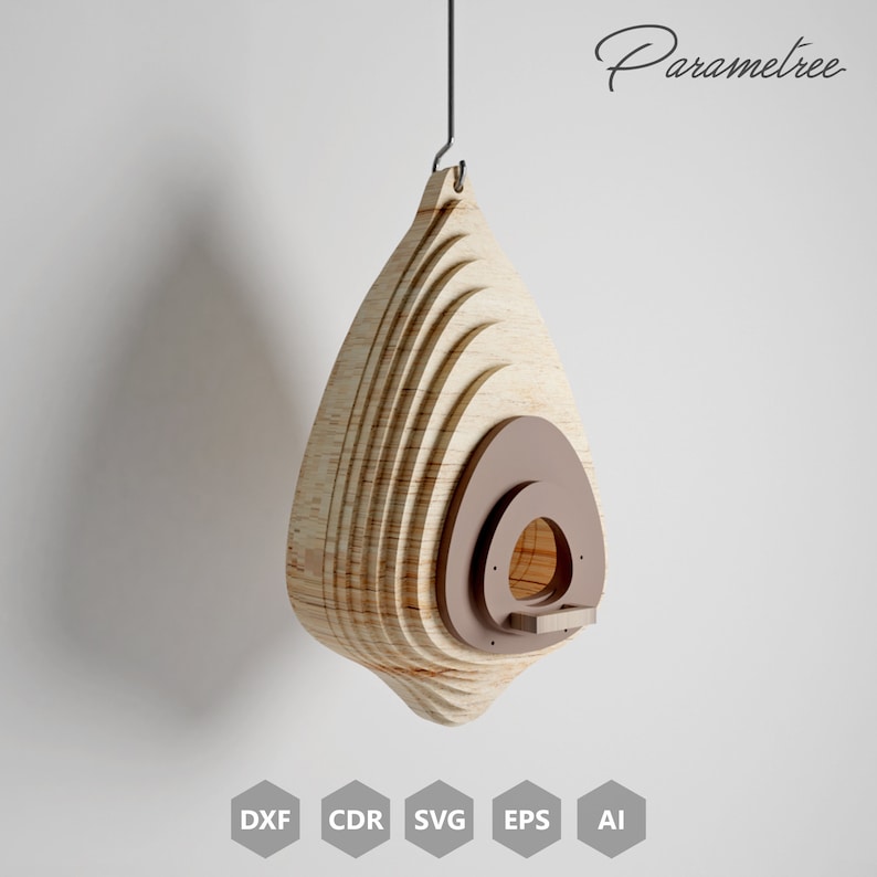 May include: A hanging wooden birdhouse with a teardrop shape. The birdhouse is made of layered light-colored wood with a brown circular entrance and a small perch. The word "Parametree" is written in cursive on the upper right.
