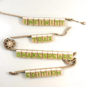 May include: Wooden track set with a green and white sign that reads "INFINITY TRAX SHAKESPEARE EDITION".