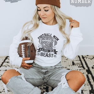 This Beauty Raised Her Beast Football Mom Shirt - Custom Football Number Shirts - Customized Football Sweater - Personalized Football Gifts