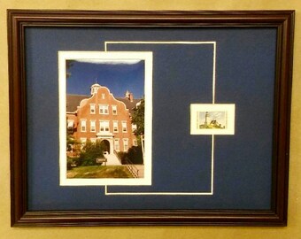 May include: A framed photograph of a brick building with a blue mat and a smaller framed photograph of a lighthouse in the upper right corner.