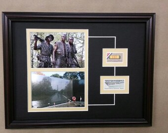 May include: A framed photo collage with three images. The top image shows a bronze sculpture of three soldiers. The bottom left image shows a black granite wall with a reflection of a building in the water. The bottom right image shows a small building with the text "Vietnam Veterans Memorial, 1982".