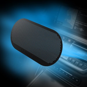 May include: A black, oval-shaped speaker with a black mesh grille. The speaker has the word "JBL" printed on the side.