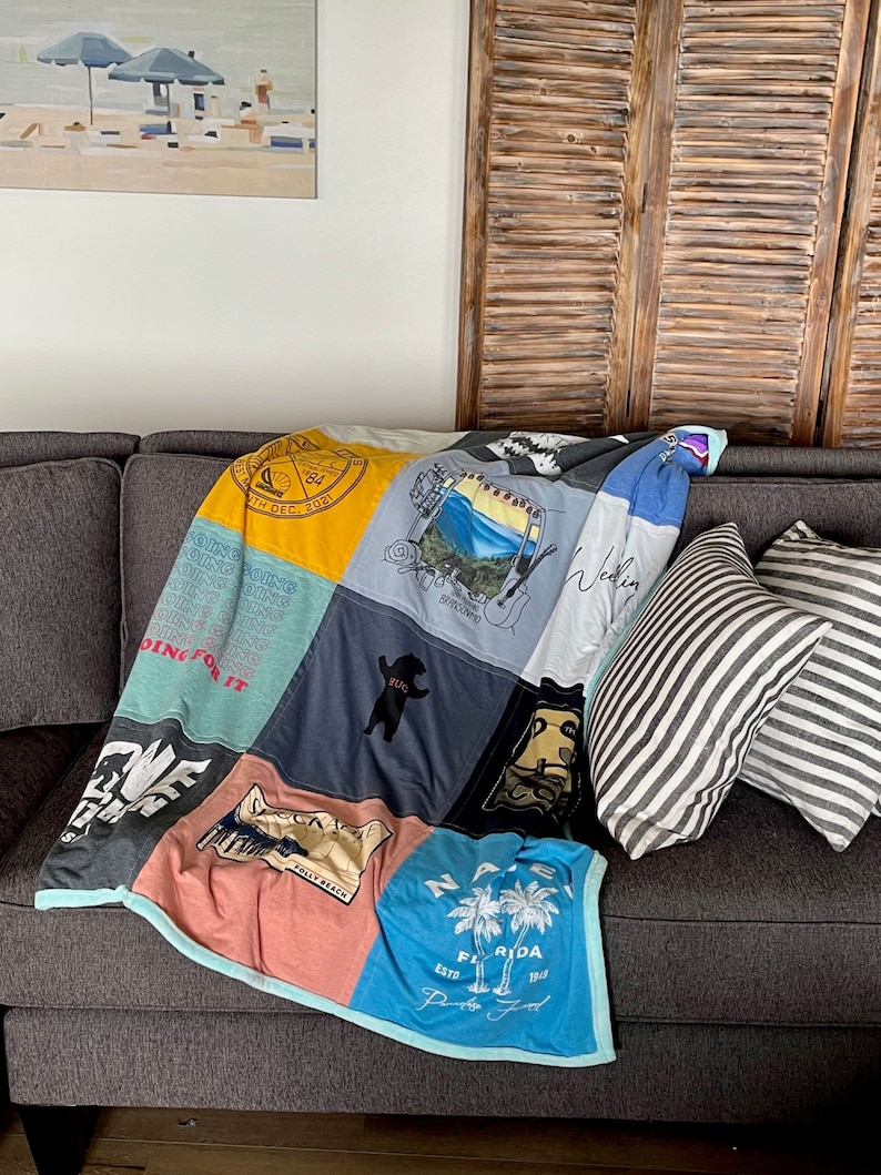 Home Display visual of the TShirt Quilt. Tshirt quilt
Custom T-shirt quilt
T-shirt blanket
Memory quilt
Personalized T-shirt quilt
T-shirt quilt design
T-shirt quilt services
T-shirt quilt gifts
Upcycled T-shirt quilt
Handmade T-shirt quilt