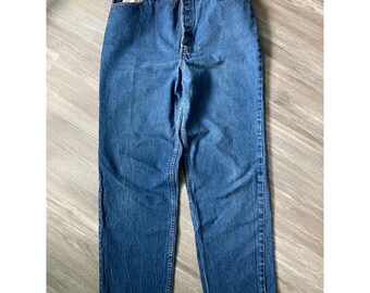 May include: A pair of high-waisted blue denim jeans featuring a classic five-pocket design, a button-fly closure, and a straight-leg cut. The fabric displays a medium-wash finish with subtle fading along the thighs and seams, complete with belt loops.
