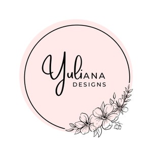May include: A pink circle with a black outline and the text "Yuliana Designs" inside. The circle is decorated with a black floral design in the lower right corner.