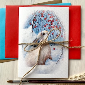 Biglietto di auguri Coniglio che cerca cibo Bacche rosse Neve Giorno invernale Fauna selvatica Carta per acquerello Biglietto pieghevole A6 Pittura acrilica Stampa