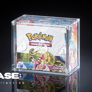 May include: A clear plastic case containing a Pokemon trading card game booster pack. The booster pack features a colourful design with the text "Pokemon Sammelkartenspiel" and "Scarlet & Violet".