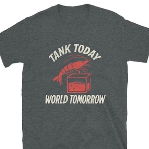May include: A dark gray t-shirt with the text "Tank Today World Tomorrow" in white. A red shrimp is pictured in a red tank.