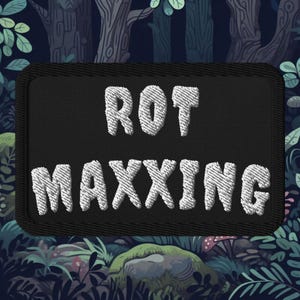 May include: A black embroidered patch with white stitching that reads "ROT MAXxing".