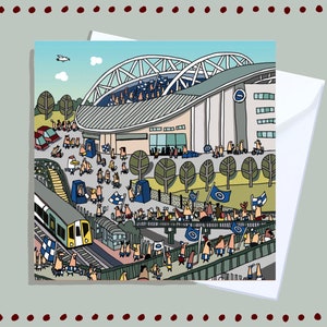 May include: A cartoon illustration of a stadium with a crowd of people in blue and white clothing. There is a train in the foreground and a bridge with people walking on it. The stadium has a large archway and a sign with a blue circle and a white letter C.