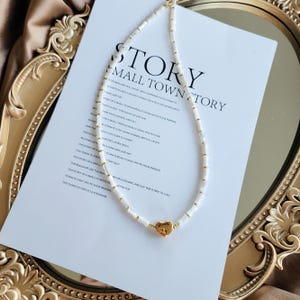Elegant mother of pearl necklace with gold heart pendant, Dainty minimalist jewelry, White layering necklace, Chic and elegant gift idea