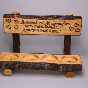 Rustic schnapps bench made of hazelnut wood with space for four shot glasses