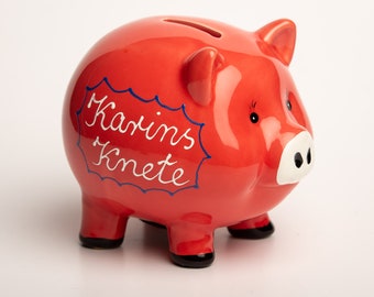 Ceramic piggy bank in light red with name