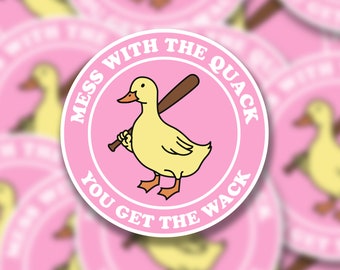 May include: A pink and white round sticker with a yellow duck holding a baseball bat. The text on the sticker reads "Mess with the quack you get the wack."