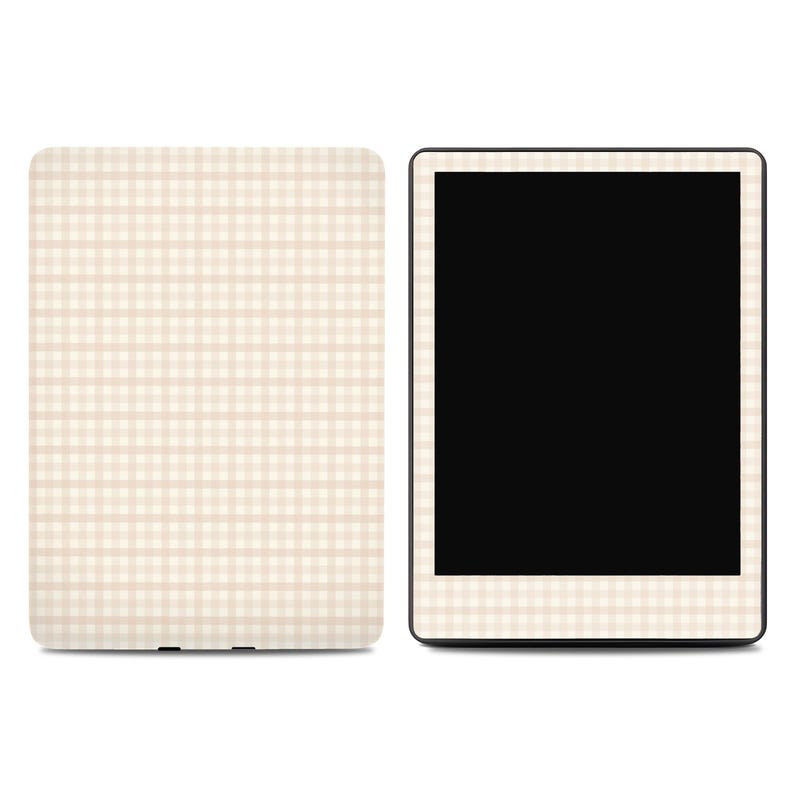 May include: A digital tablet and a matching cover, both featuring a beige and white gingham pattern. The tablet has a black screen and a thin, patterned border. The cover is rectangular with rounded corners.