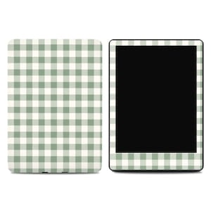May include: A digital tablet and a matching cover, both featuring a green and white gingham pattern. The tablet has a black screen, and the cover is designed to protect the device. The design is a classic, country-inspired aesthetic.