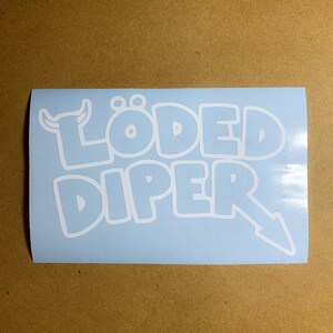 May include: A light blue sticker with white lettering that reads "L&Ouml;DED DIPER" with a small white cartoon bull's head to the left of the text.