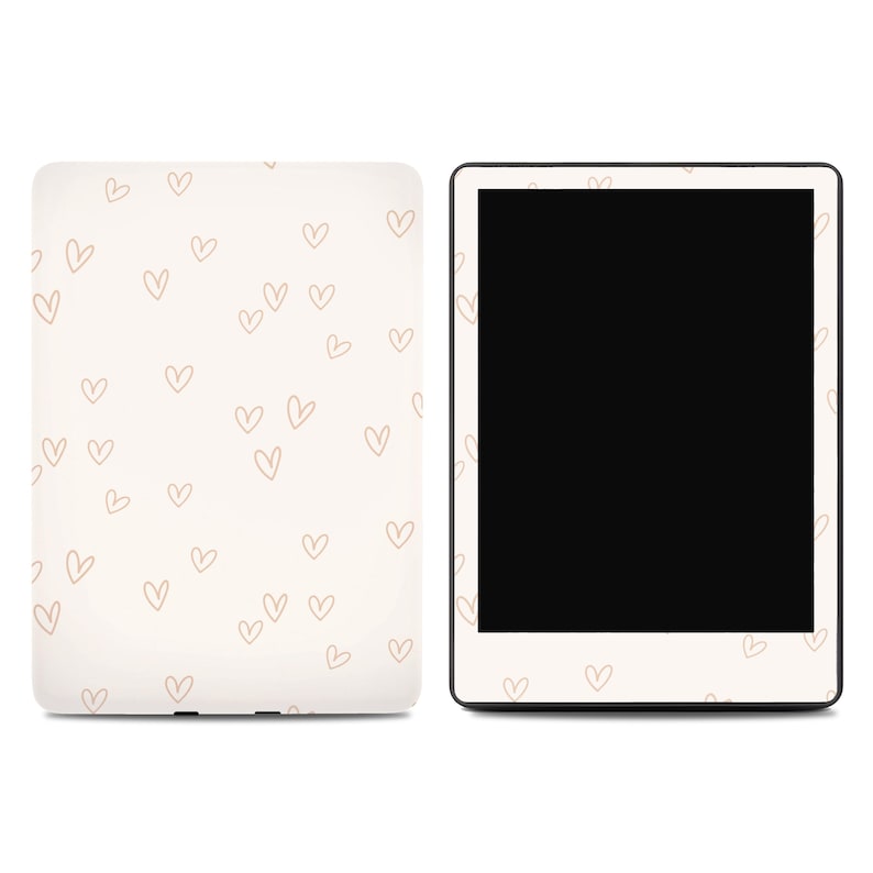 May include: A cream-colored tablet case and tablet with a black screen. The case is covered in small, light brown heart outlines. The tablet has a black screen and a white border with heart outlines.
