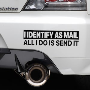 May include: A white car with a black bumper sticker that reads "I Identify as Mail All I Do Is Send It"
