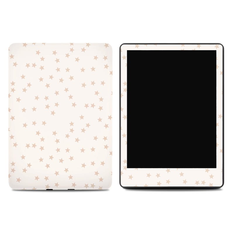 May include: A cream-colored tablet and cover set with a repeating pattern of small, light brown stars. The tablet has a black screen and a white border with the star pattern. The cover is also cream-colored with the star design.