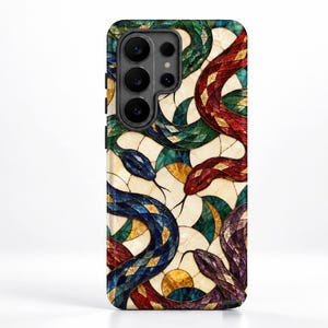 May include: A rectangular smartphone case featuring a stained glass mosaic pattern of multiple snakes in red, green, blue, and purple. The design includes circular shapes and dark outlines against a cream-coloured background, covering the entire back surface.