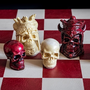 Made to order – Chess set, Skulls design in stone and aged red colour. BOARD NOT INCULDED