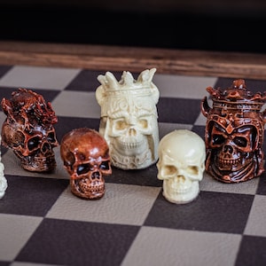 Made to order – Chess set, Skulls design in aged mahogany and stone. BOARD NOT INCULDED