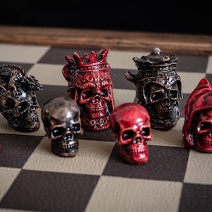 Made to order – Chess set, Skulls design in aged red and ebony colour. BOARD NOT INCULDED