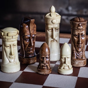 Made to order – Chess set, Gothic heads design, similar to one used in orginal Star Trek series. In aged cream & walnut. BOARD NOT INCULDED