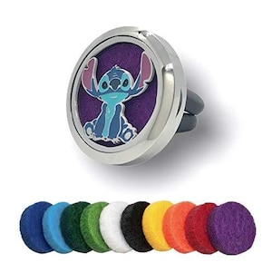 May include: A silver car air freshener with a blue Stitch character from Lilo & Stitch. The air freshener has a purple felt pad inside and comes with a pack of 10 felt pads in assorted colors.