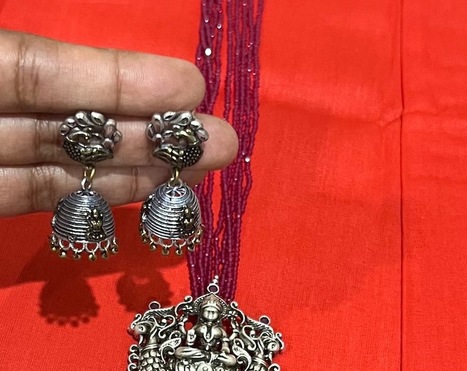 Gorgeous German Silver  pink beaded Necklace with  laksmi pendant and ear rings .
