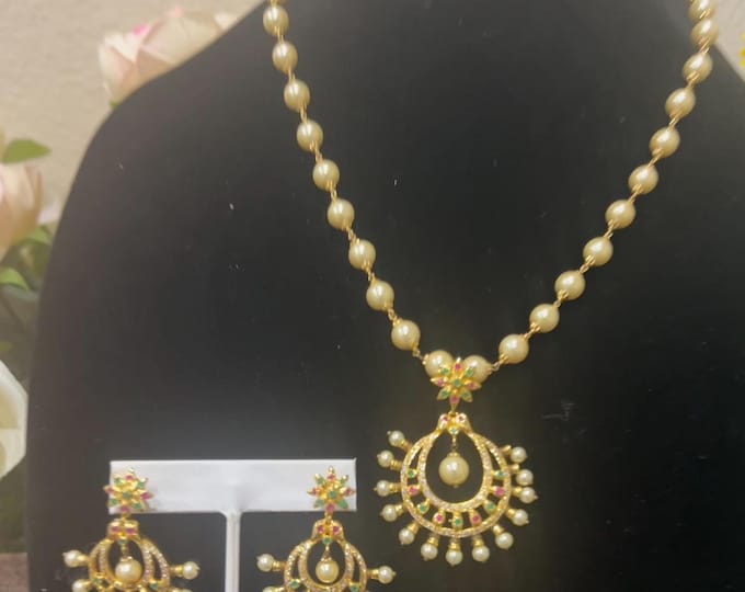 Radiant Gold-Plated Necklace with Pearls Naclave crafted with ruby and emerald stones dollar and Matching Earrings