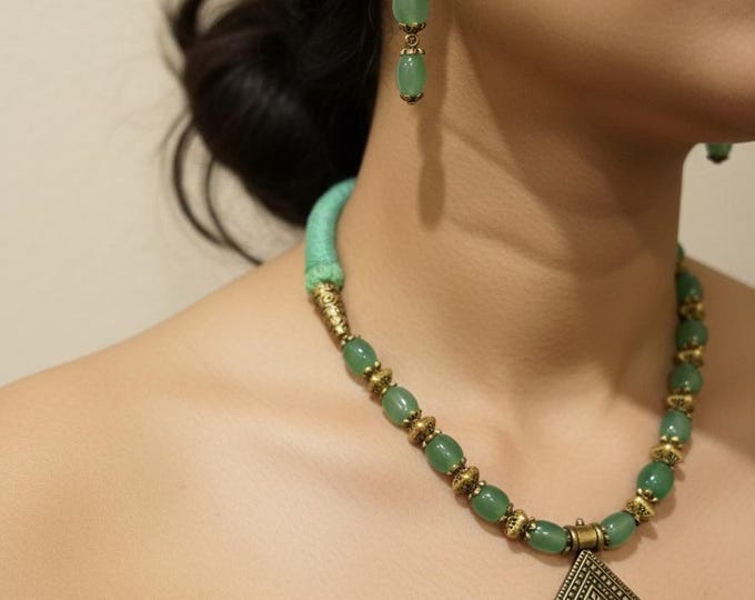 Green Beaded Necklace with Gold Pendant and Earrings